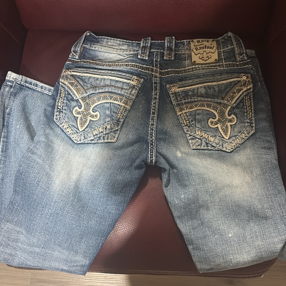 Rock Revival Faded Blue Men's Jeans with Intricate Stitching